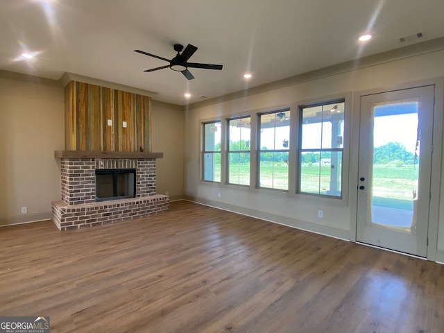 unfurnished living room featuring visible vents, wood finished floors, baseboards, recessed lighting, and a ceiling fan