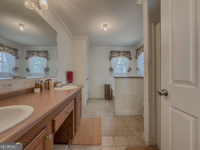 2188 Hi Roc Cir, Conyers, GA 30012 - bathroom featuring double vanity, a textured ceiling, a sink, and tile patterned floors