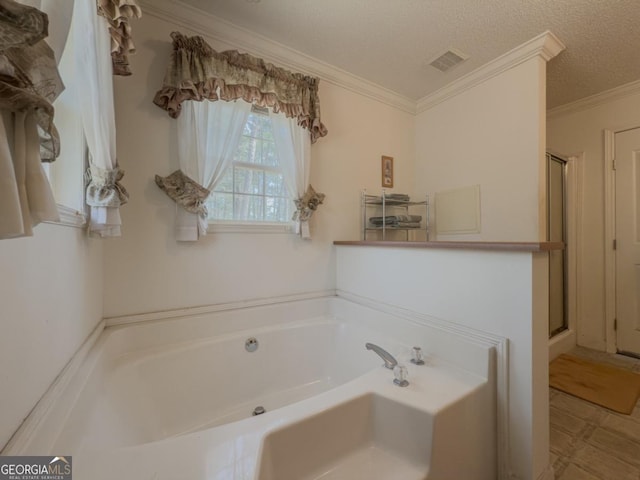 2188 Hi Roc Cir, Conyers, GA 30012 - bathroom with visible vents, ornamental molding, a textured ceiling, a bath, and a stall shower