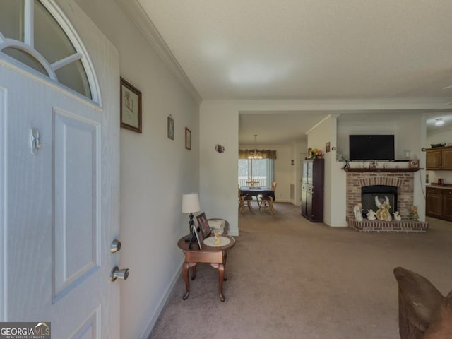 2188 Hi Roc Cir, Conyers, GA 30012 - carpeted entrance foyer featuring crown molding, baseboards, a fireplace, and a chandelier