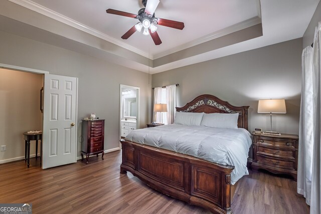 bedroom featuring crown molding, baseboards, and wood finished floors