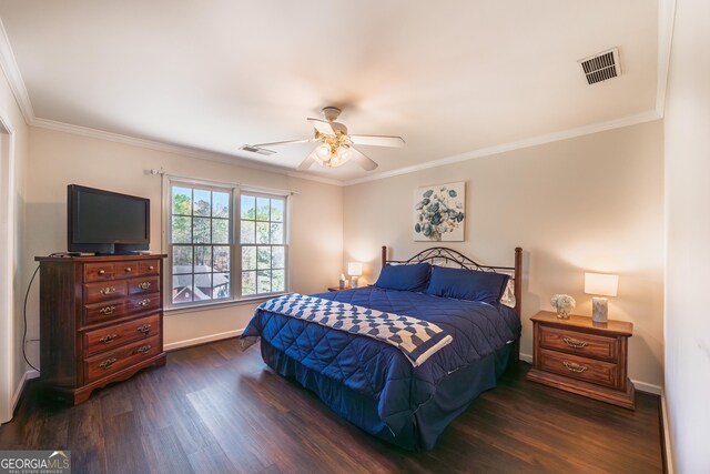 bedroom featuring ornamental molding, dark wood finished floors, and visible vents