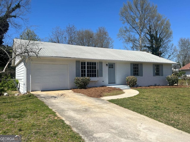 ranch-style home with an attached garage, a front lawn, concrete driveway, and brick siding