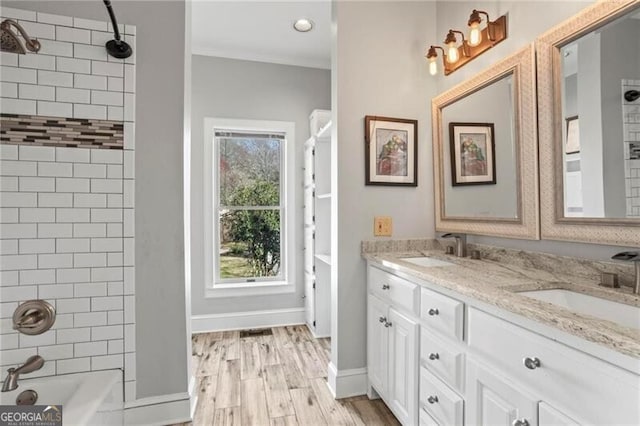 417 Lynne Cir, Alpharetta, GA 30009 - bathroom with double vanity,  shower combination, a sink, and wood finished floors