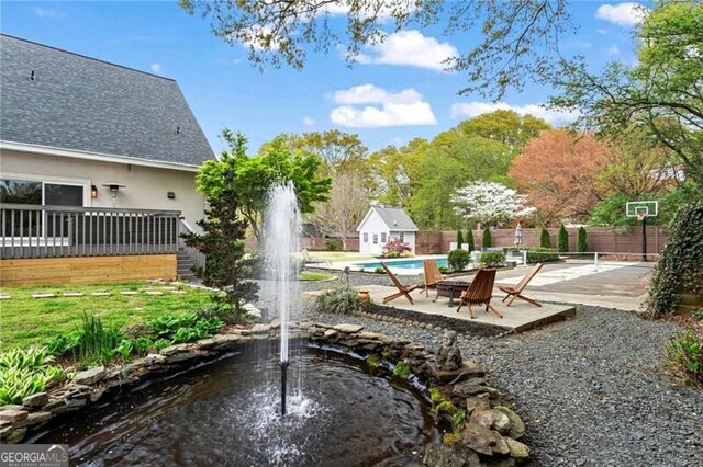 417 Lynne Cir, Alpharetta, GA 30009 - view of property's community featuring a patio area, a pool, fence, and a wooden deck