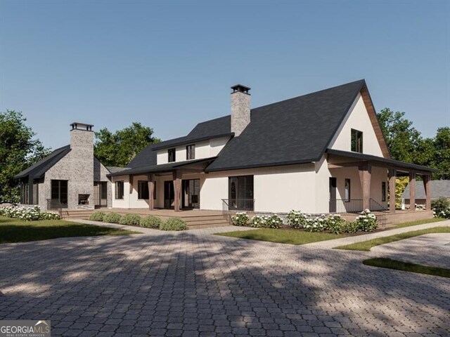 417 Lynne Cir, Alpharetta, GA 30009 - exterior space featuring a chimney, a porch, and stucco siding