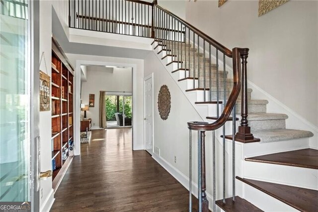 417 Lynne Cir, Alpharetta, GA 30009 - stairs with baseboards, a high ceiling, and wood finished floors