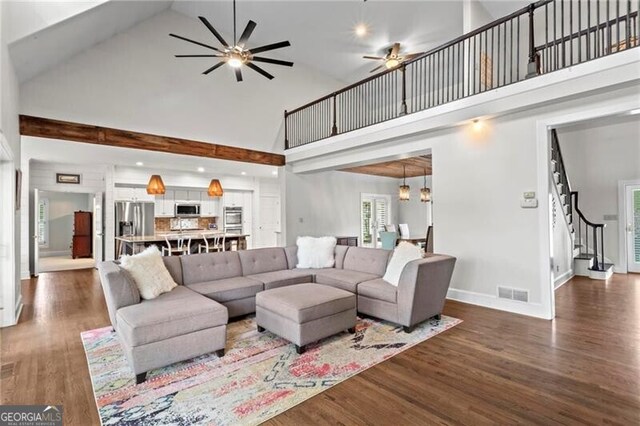 417 Lynne Cir, Alpharetta, GA 30009 - living area featuring visible vents, baseboards, ceiling fan, stairway, and high vaulted ceiling