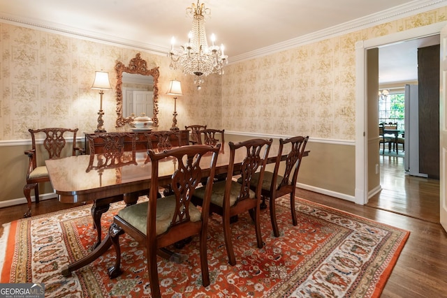 812 Burning Tree Ct SE, Marietta, GA 30067 - dining area featuring wood finished floors, a chandelier, wallpapered walls, baseboards, and crown molding