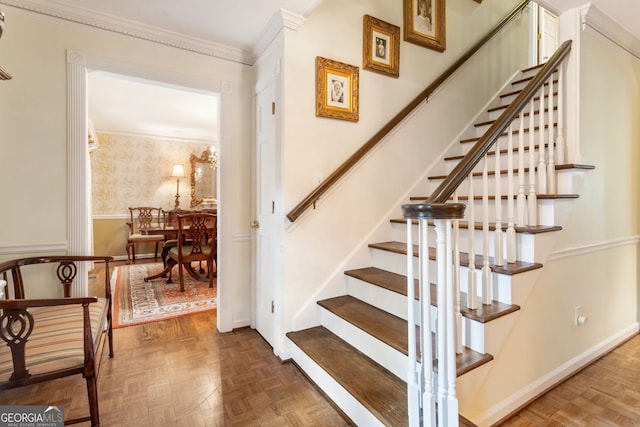 812 Burning Tree Ct SE, Marietta, GA 30067 - stairway with wallpapered walls, a wainscoted wall, crown molding, and baseboards