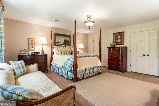 812 Burning Tree Ct SE, Marietta, GA 30067 - bedroom featuring wood finished floors and a closet