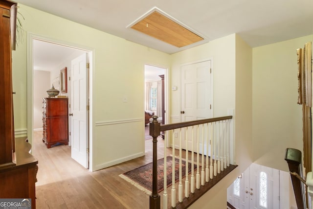 812 Burning Tree Ct SE, Marietta, GA 30067 - hallway with an upstairs landing, light wood-style floors, healthy amount of natural light, and baseboards