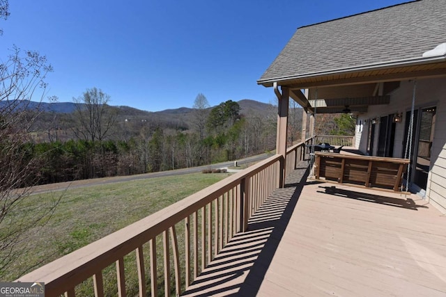 47 Hidden Fields Rd, Hiawassee, GA 30546 - wooden deck with a lawn, ceiling fan, and a mountain view
