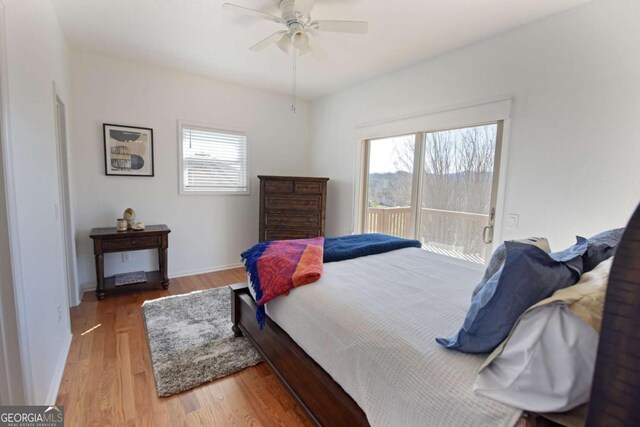 47 Hidden Fields Rd, Hiawassee, GA 30546 - bedroom with wood finished floors and ceiling fan