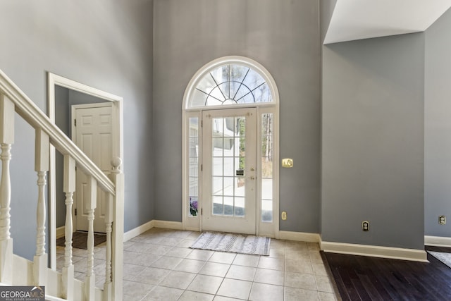 5163 Holly Springs Dr, Douglasville, GA 30135 - foyer entrance with a high ceiling, plenty of natural light, and baseboards
