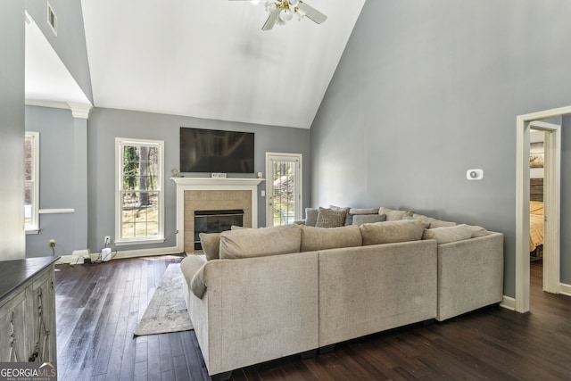 5163 Holly Springs Dr, Douglasville, GA 30135 - living room featuring high vaulted ceiling, baseboards, dark wood finished floors, ceiling fan, and a tiled fireplace
