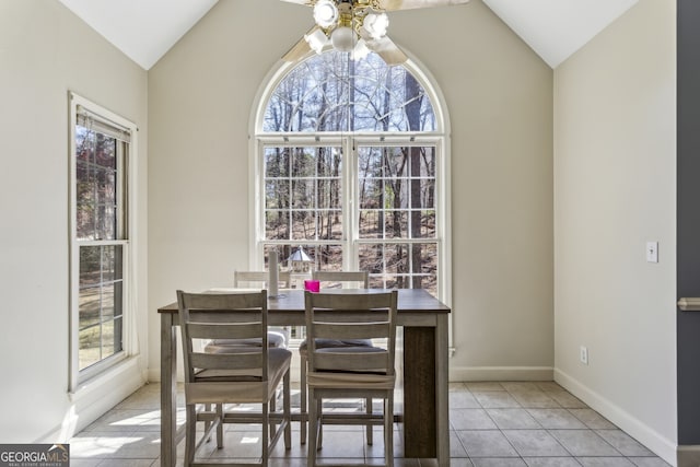5163 Holly Springs Dr, Douglasville, GA 30135 - dining area with light tile patterned flooring, baseboards, lofted ceiling, and a ceiling fan