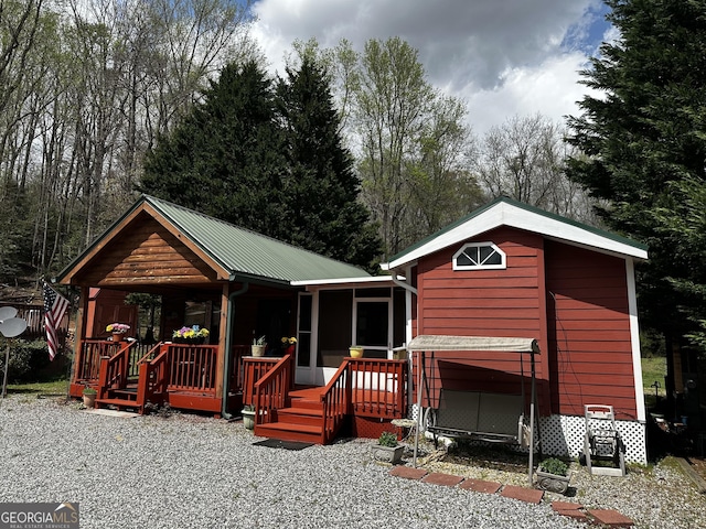 88 Fishtail Cir, Cleveland, GA 30528 - view of front facade with a metal roof and a sunroom