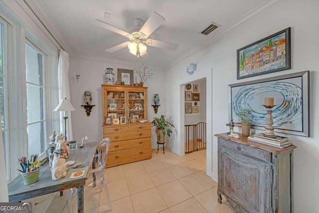 office featuring visible vents, crown molding, ceiling fan, and light tile patterned floors