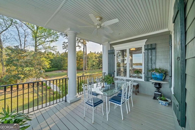 wooden deck featuring ceiling fan and outdoor dining space