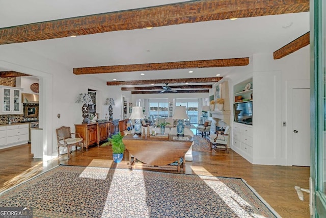 dining space with recessed lighting, beam ceiling, ceiling fan, and built in shelves