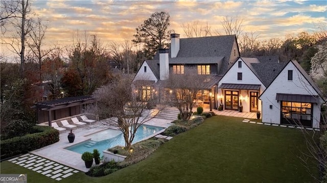 5495 Mount Vernon Pkwy, Atlanta, GA 30327 - back of house featuring a pergola, an outdoor pool, a chimney, a standing seam roof, and a patio