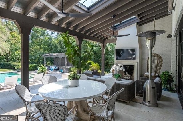 5495 Mount Vernon Pkwy, Atlanta, GA 30327 - living room with a stone fireplace, beam ceiling, wood finished floors, stairway, and baseboards