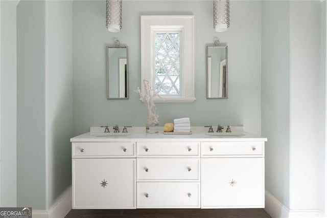 5495 Mount Vernon Pkwy, Atlanta, GA 30327 - bar featuring backsplash, baseboards, and a sink