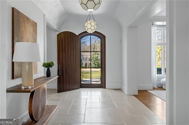 5495 Mount Vernon Pkwy, Atlanta, GA 30327 - dining area with a wealth of natural light, ornamental molding, and a notable chandelier