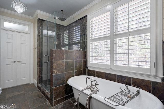 full bathroom with plenty of natural light, a stall shower, and crown molding
