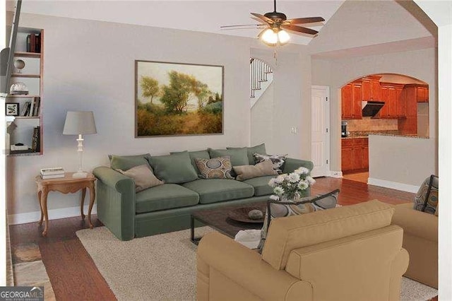 3124 Bentgrass Ln, Kennesaw, GA 30144 - living area with arched walkways, ceiling fan, wood finished floors, and stairs