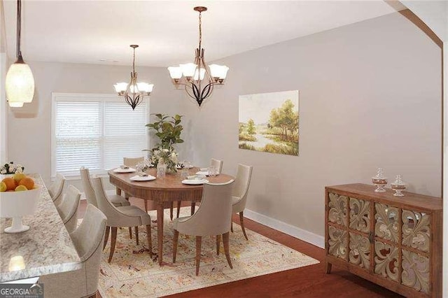 3124 Bentgrass Ln, Kennesaw, GA 30144 - dining area with wood finished floors and a chandelier