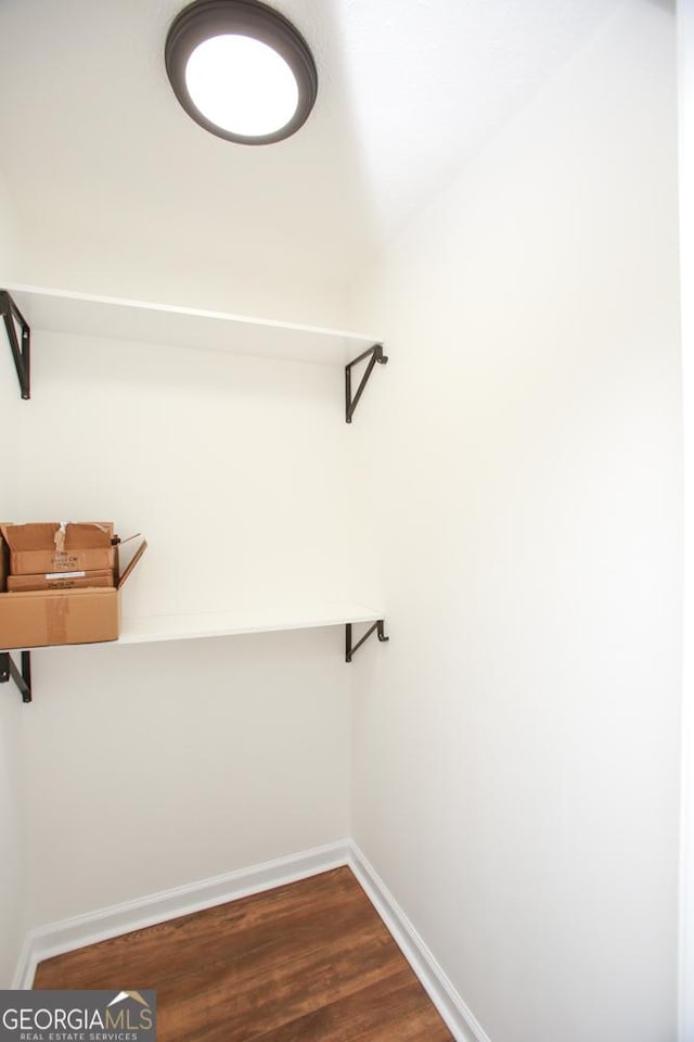 759 Oak Grove Rd, Carrollton, GA 30117 - walk in closet with dark wood-style floors