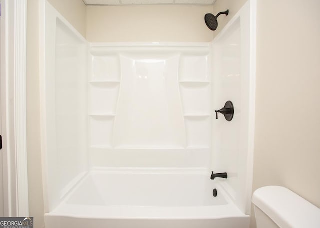 759 Oak Grove Rd, Carrollton, GA 30117 - full bathroom with toilet, wood finished floors, shower / tub combination, a paneled ceiling, and baseboards