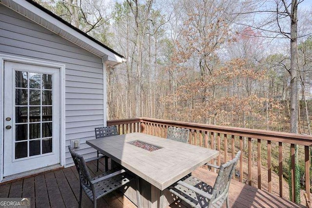 802 Eagle Glen Xing, Woodstock, GA 30189 - wooden terrace with outdoor dining space