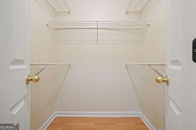 802 Eagle Glen Xing, Woodstock, GA 30189 - spacious closet with light wood-style flooring