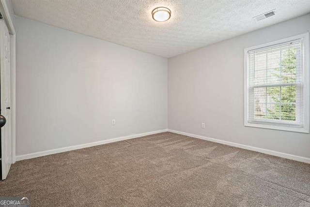 802 Eagle Glen Xing, Woodstock, GA 30189 - empty room with carpet and a textured ceiling