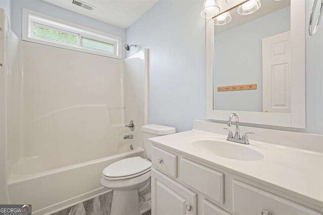 802 Eagle Glen Xing, Woodstock, GA 30189 - full bathroom featuring vanity, shower / bath combination, and wood finished floors