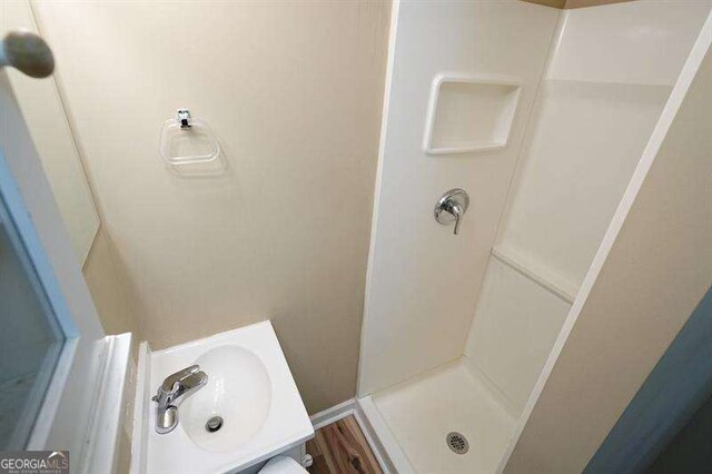 802 Eagle Glen Xing, Woodstock, GA 30189 - full bathroom featuring a shower stall and a sink