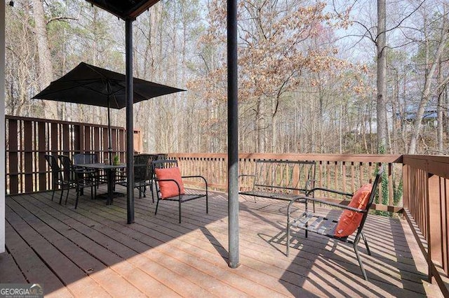 802 Eagle Glen Xing, Woodstock, GA 30189 - wooden terrace with outdoor dining area