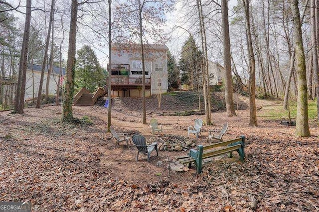802 Eagle Glen Xing, Woodstock, GA 30189 - view of yard with stairs, a wooden deck, and a fire pit