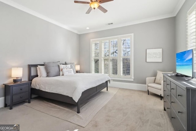bedroom featuring multiple windows, light colored carpet, crown molding, baseboards, and a ceiling fan