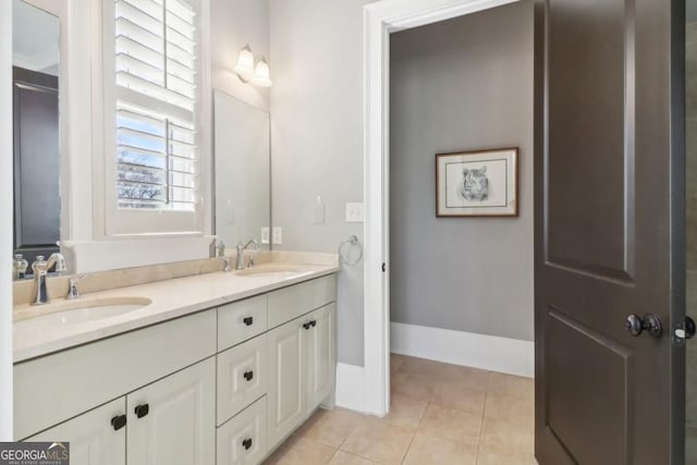 bathroom featuring tile patterned floors and double vanity