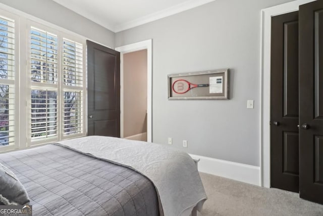 bedroom featuring carpet and crown molding