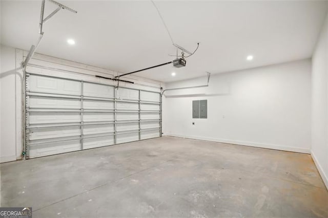 garage with baseboards and a garage door opener