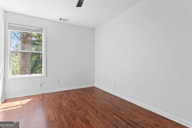 382 Deckner Ave SW, Atlanta, GA 30310 - spare room with baseboards, ceiling fan, visible vents, and wood finished floors