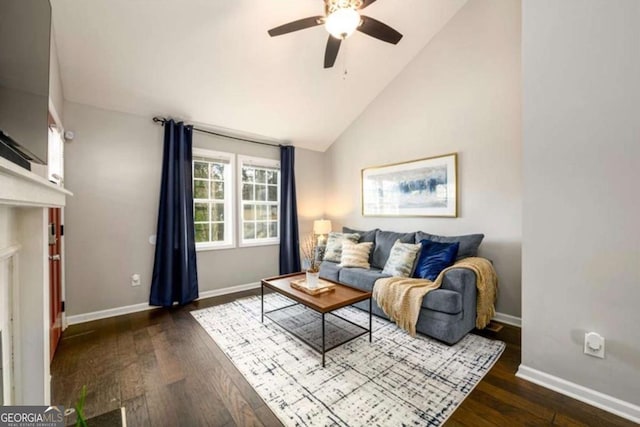 living room featuring baseboards, vaulted ceiling, ceiling fan, and hardwood / wood-style flooring