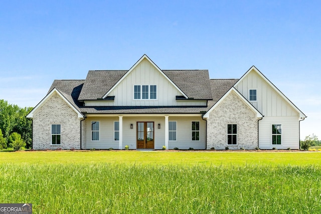 264 Community House Rd, Barnesville, GA 30204 - modern farmhouse with board and batten siding, french doors, a front lawn, and a shingled roof