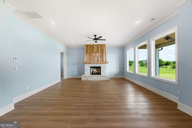 264 Community House Rd, Barnesville, GA 30204 - unfurnished living room with a ceiling fan, crown molding, a fireplace, dark wood-style flooring, and baseboards
