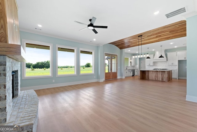 264 Community House Rd, Barnesville, GA 30204 - unfurnished living room with a brick fireplace, ceiling fan, baseboards, recessed lighting, and plenty of natural light